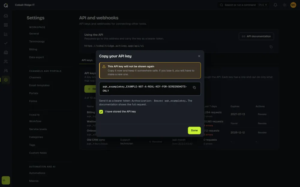 The ActiveQ dialog that shows a new API key once: a warning that it will not be shown again, the key in a copy field, and a box to tick to confirm it is stored. Sample data.