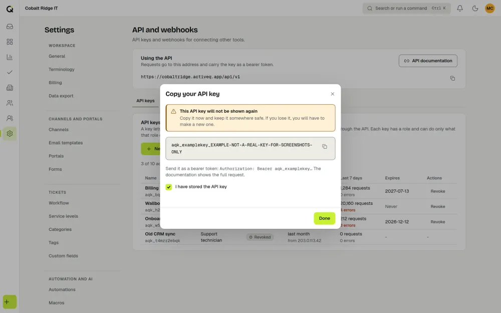 The ActiveQ dialog that shows a new API key once: a warning that it will not be shown again, the key in a copy field, and a box to tick to confirm it is stored. Sample data.